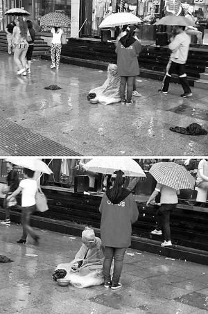 女孩为乞讨老人撑伞