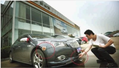 5月8日，长沙市雀园路九通雪佛兰4S店，黄先生的车出现多处刮擦。记者 李丹 摄 