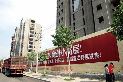 青岛二手房价高于新房 中介兼职卖新房