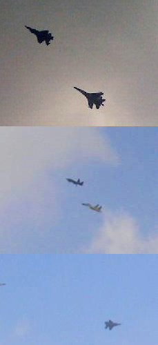 资料图：AMF五代战机在歼-11BS战斗机的伴随下进行通场飞行。