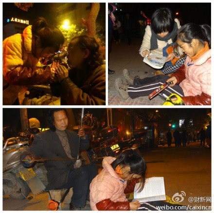 12岁女孩牵盲父卖艺 路灯下写作业(图)