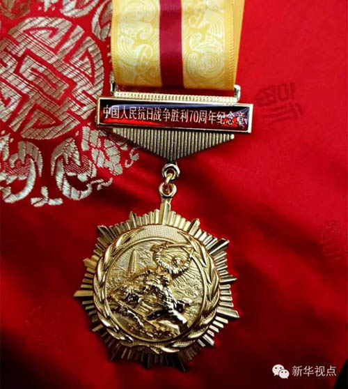 抗战胜利70周年纪念章图案有何寓意
